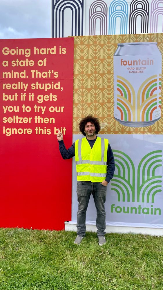 Fadi Shuman with Fountain hard seltzer at a festival