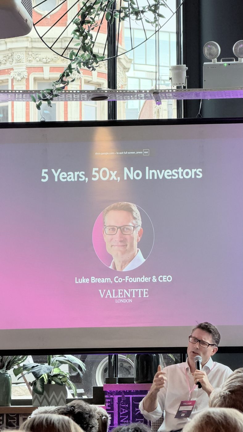 Luke Bream speaking under a slide that reads 5 Years, 50x, No Investors