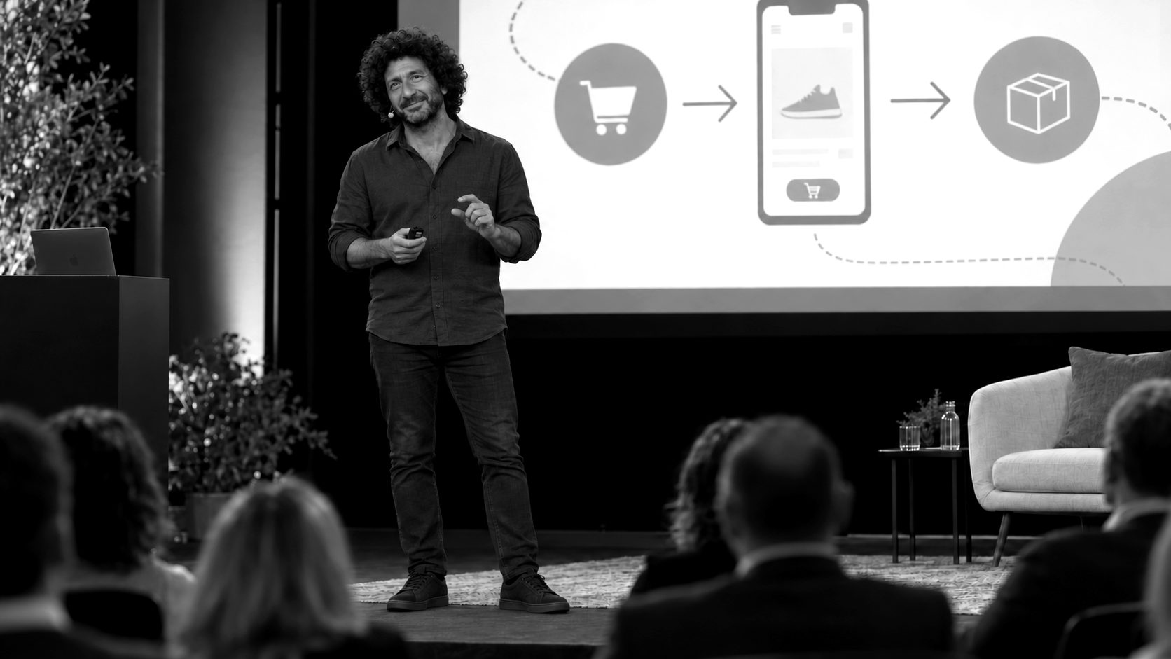 Fadi Shuman speaking on stage about ecommerce and AI